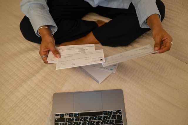 a person sorting through cheques